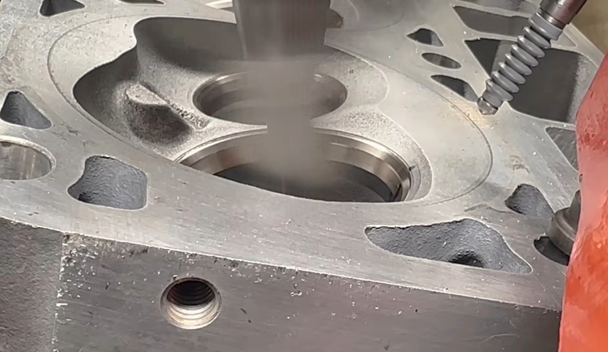 Precision valve seat cutter with pilot in a cylinder head port
