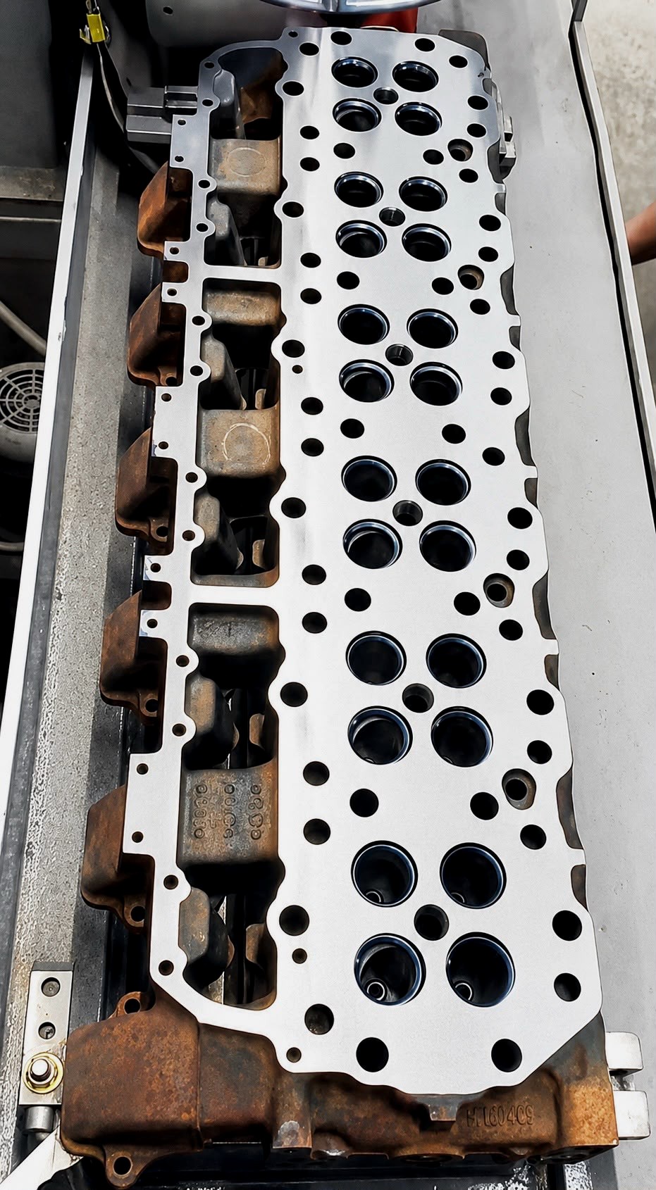 Carbide cutter resurfacing the deck of a cast iron diesel cylinder head
