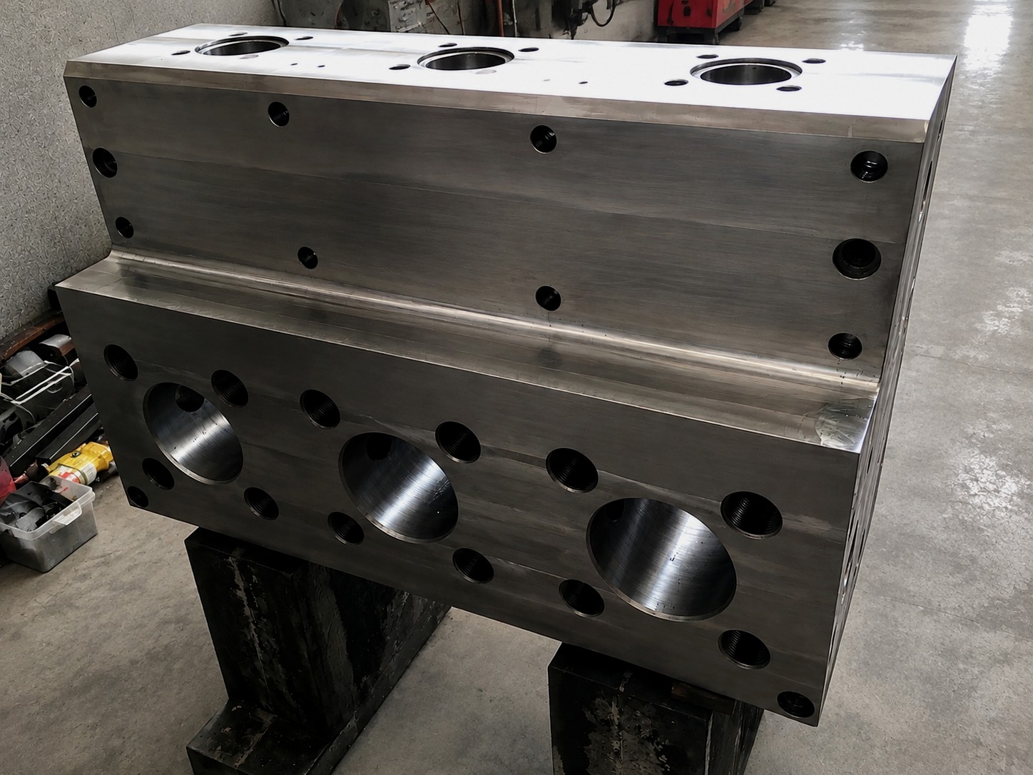 Precision lathe turning a steel engine shaft component